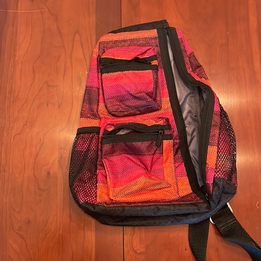 Thirty-One adjustable side sling backpack